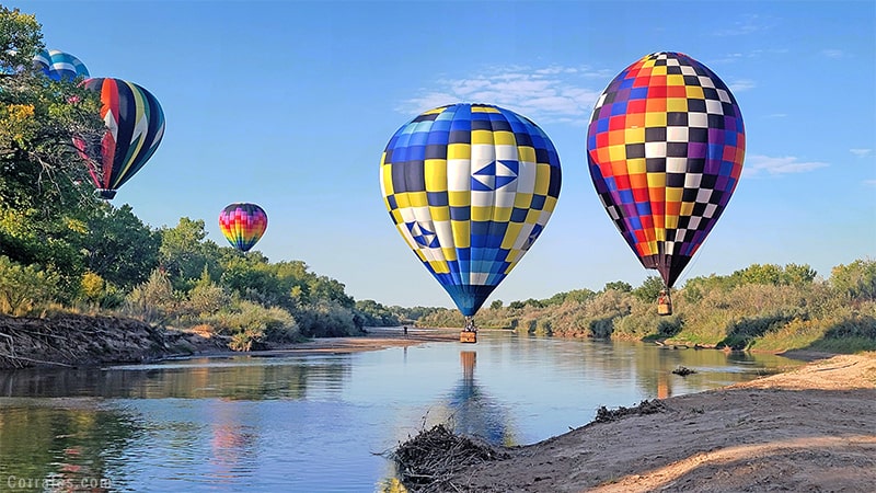 Balloons landing in water Corrales